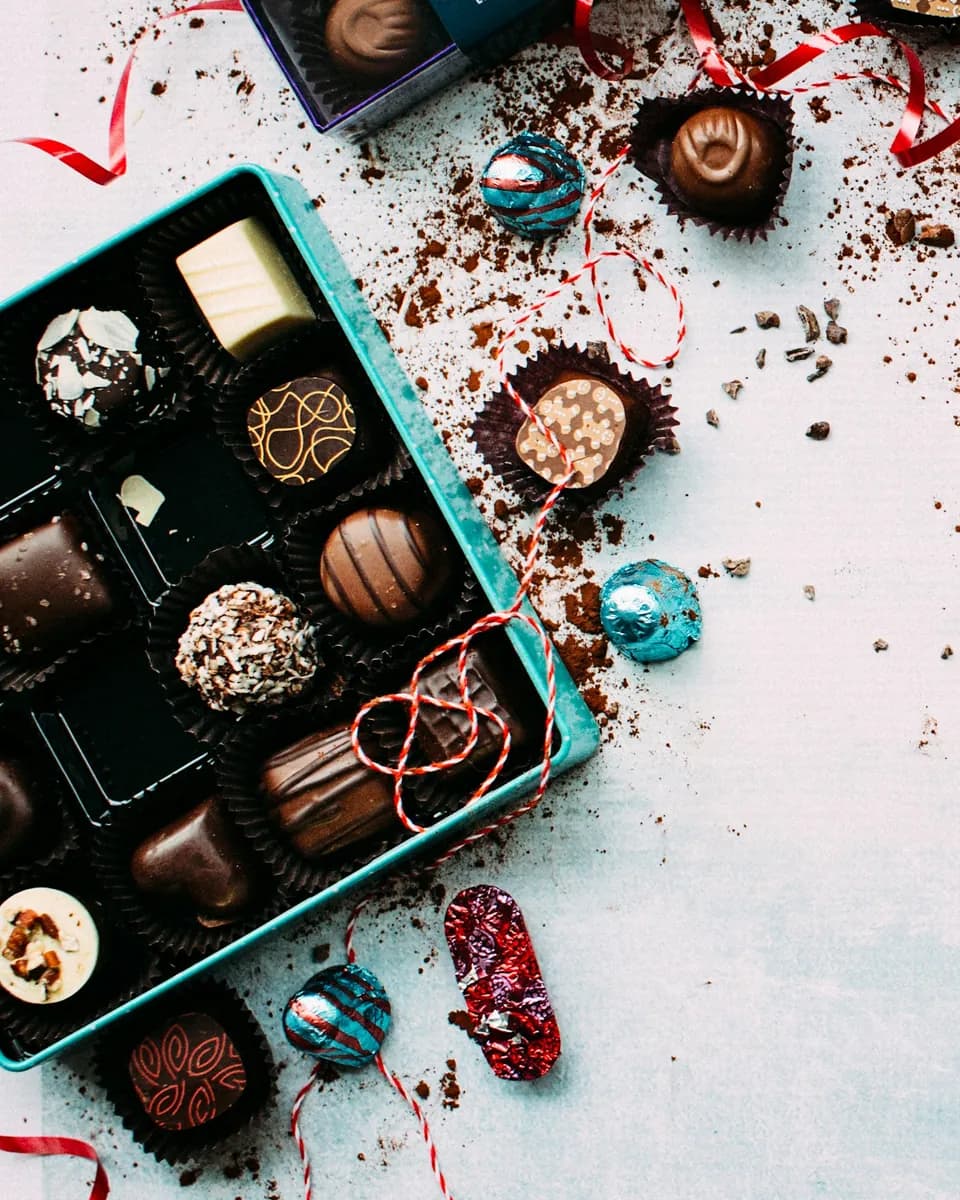 An open box of assorted handmade truffles